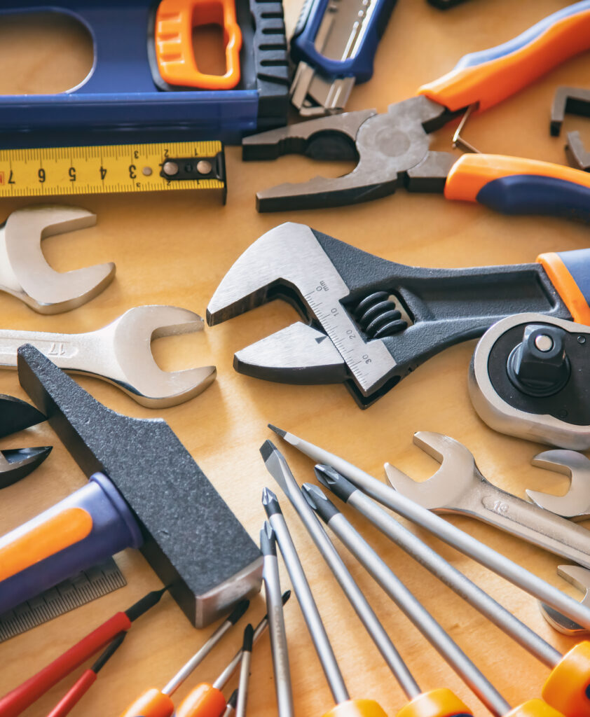 DIY, maintenance service works concept. Home repair tools set on wooden background.